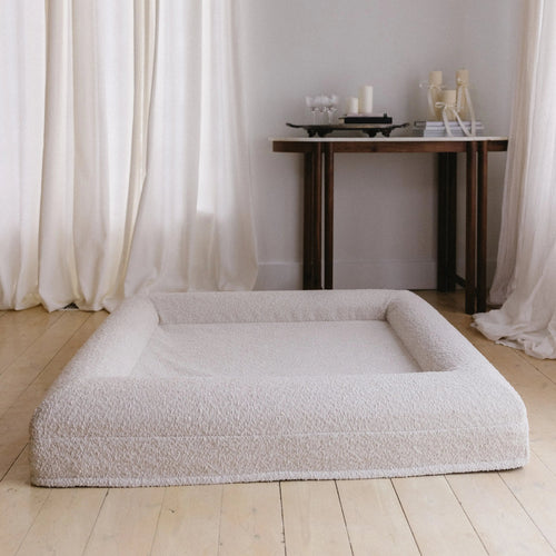 Image of Medium/Large Bouclé Dog Bed with cream boucle fabric and memory foam, styled in a modern living room setting