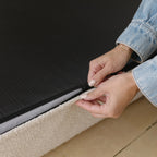 Underside of the dog bed showing the non-slip grip bottom surface