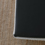 Underside of the dog bed showing the non-slip grip bottom surface
