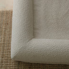 Close-up of soft crème boucle texture on XS/S dog bed cover