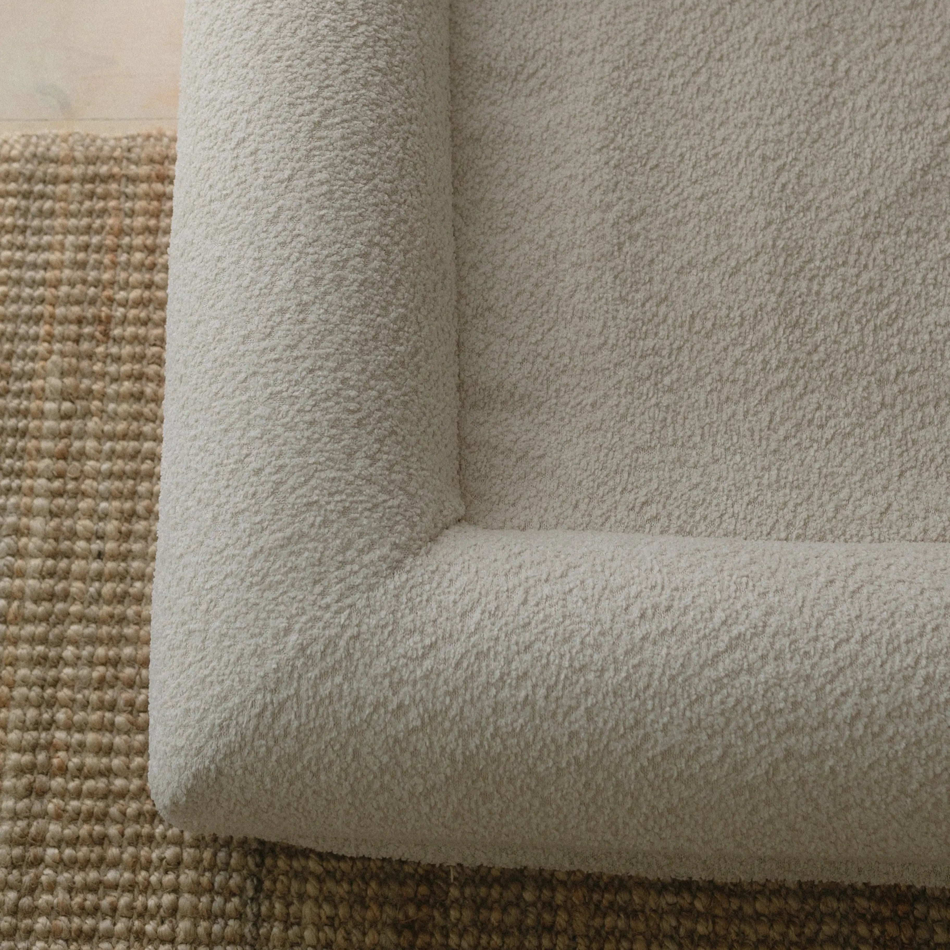 Close-up of soft crème boucle texture on XS/S dog bed cover